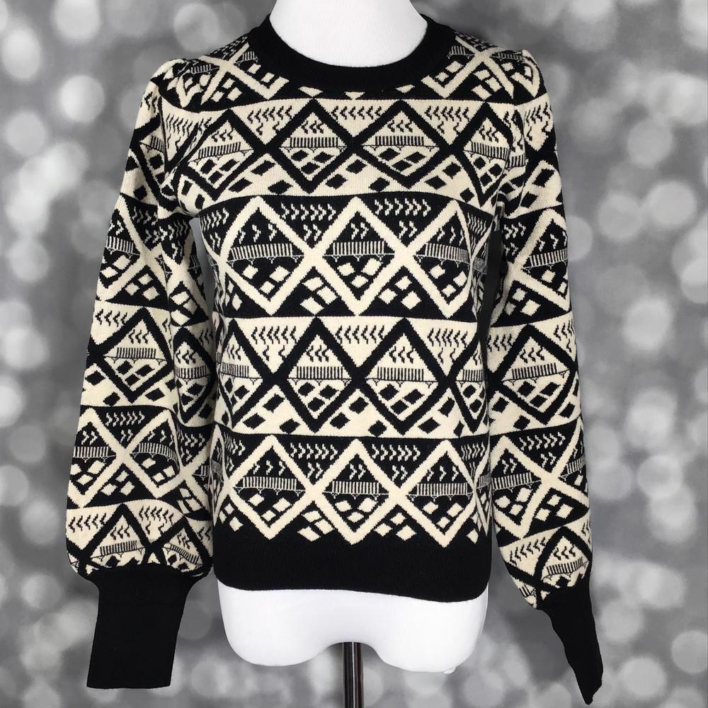 LuLaRoe crewneck sweater in black and ivory geometric diamond print featuring tribal-inspired pattern and solid black ribbed cuffs and hem