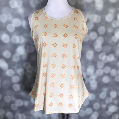 LuLaRoe beige tank top with orange sun print, featuring a scoop neckline, sleeveless design, and relaxed fit displayed on a mannequin