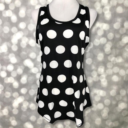 LuLaRoe black tank top with large white polka dot print, featuring a scoop neckline, sleeveless design, and relaxed fit displayed on a mannequin against a blurred background