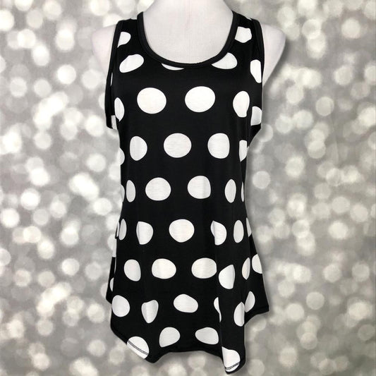 LuLaRoe black tank top with large white polka dot print, featuring a scoop neckline, sleeveless design, and relaxed fit displayed on a mannequin against a blurred background