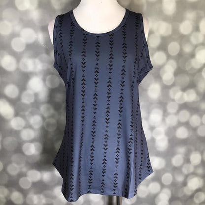 LuLaRoe blue tank top with black vertical Aztec stripe pattern, featuring a scoop neckline, sleeveless design, and relaxed fit displayed on a mannequin