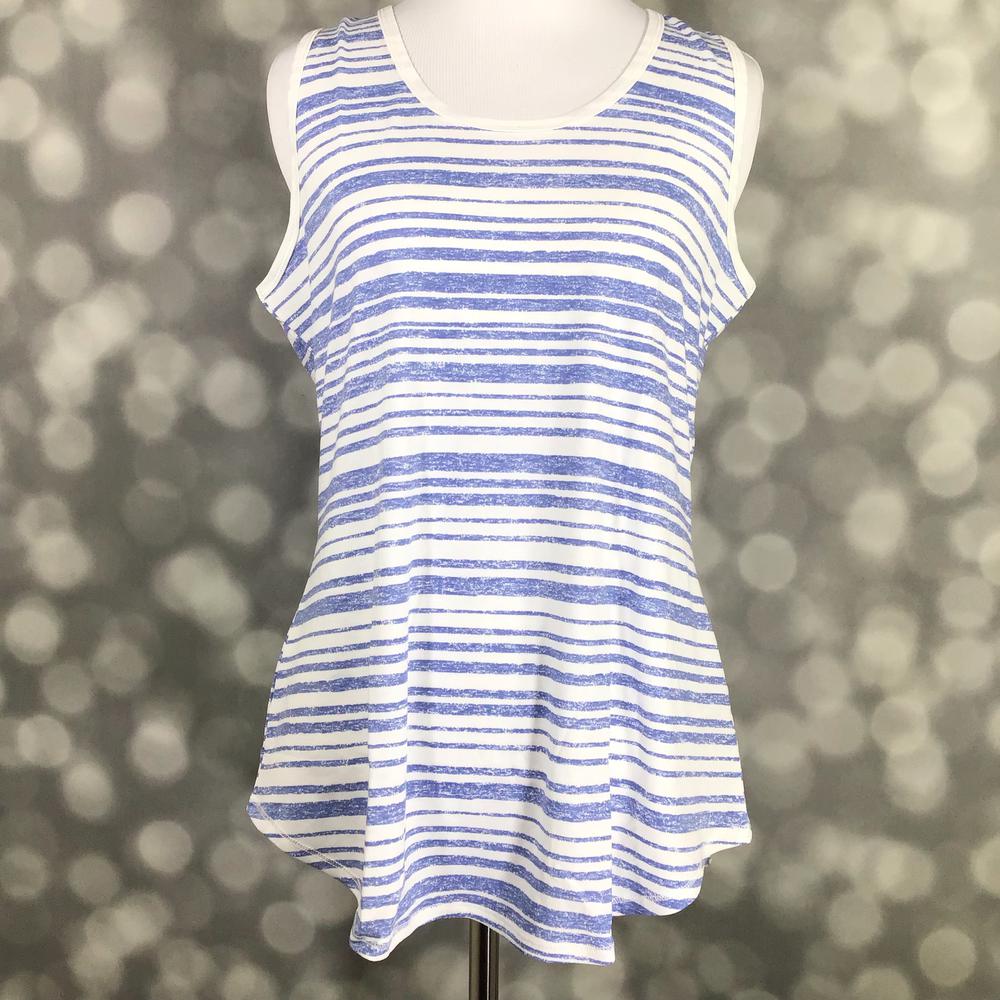 LuLaRoe tank top featuring distressed periwinkle blue and white horizontal stripes. Women's sleeveless tank with a relaxed fit and coastal-inspired nautical stripe pattern for casual summer outfits on a mannequin against a blurred background