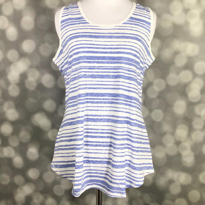 LuLaRoe tank top featuring distressed periwinkle blue and white horizontal stripes. Women's sleeveless tank with a relaxed fit and coastal-inspired nautical stripe pattern for casual summer outfits on a mannequin against a blurred background