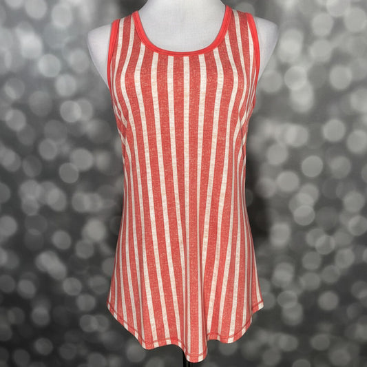 LuLaRoe coral and cream vertical striped tank top with scoop neckline, sleeveless design, and relaxed fit displayed on a mannequin against a blurred background