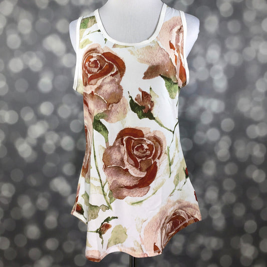 LuLaRoe ivory sleeveless tank top with large watercolor rose floral print in blush and terracotta tones, scoop neckline, and relaxed fit displayed on a mannequin against a blurred background