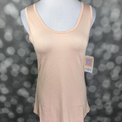 LuLaRoe solid nude beige tank top with blush undertone, scoop neckline, sleeveless design, and relaxed fit displayed on a mannequin with a blurred background