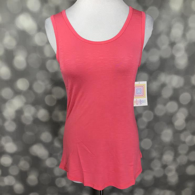 LuLaRoe solid coral pink tank top with scoop neckline, sleeveless design, and relaxed fit displayed on a mannequin against a blurred gray background