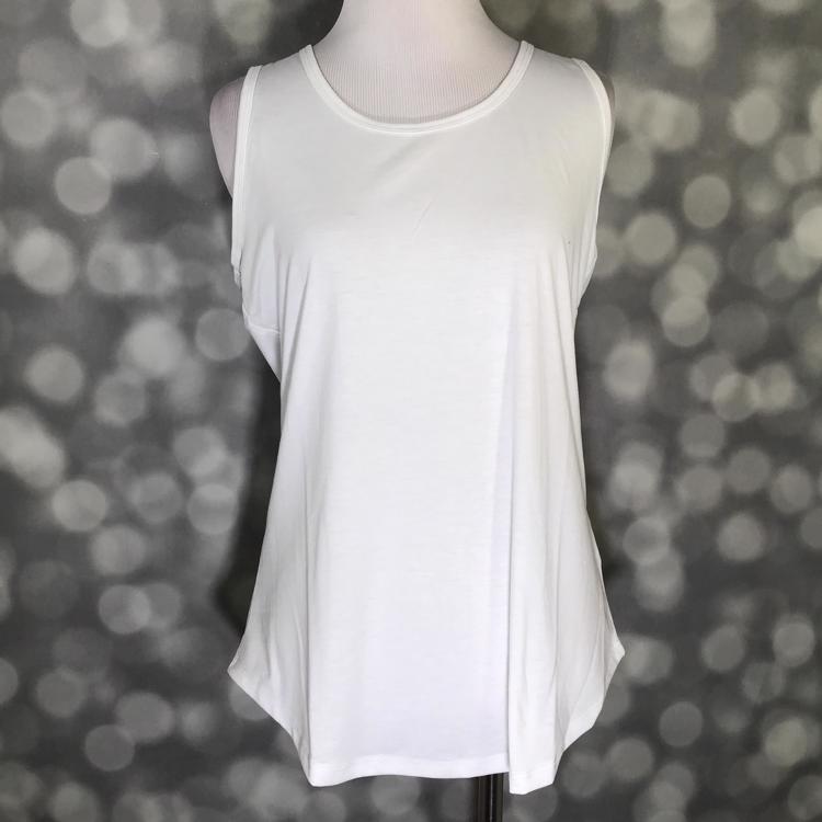 LuLaRoe solid white tank top with scoop neckline, sleeveless design, and relaxed fit displayed on a mannequin