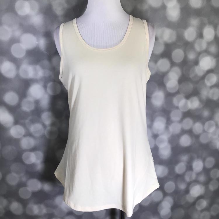 LuLaRoe solid light beige tank top with gray undertone, featuring a scoop neckline, sleeveless design, and relaxed fit displayed on a mannequin