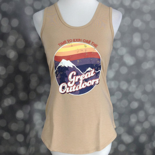 LuLaRoe tan sleeveless tank top with retro sunset mountain graphic and “Time To Explore the Great Outdoors” text, scoop neckline, and relaxed fit displayed on a mannequin against a blurred background