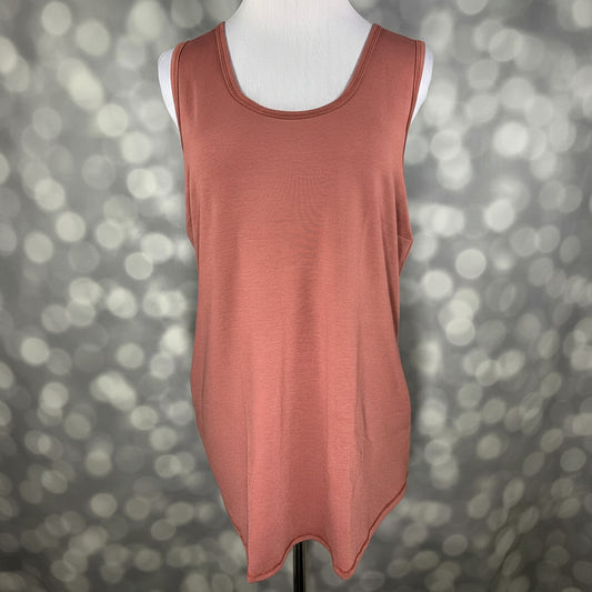 LuLaRoe terracotta clay sleeveless tank top with scoop neckline and relaxed fit displayed on a mannequin against a blurred background