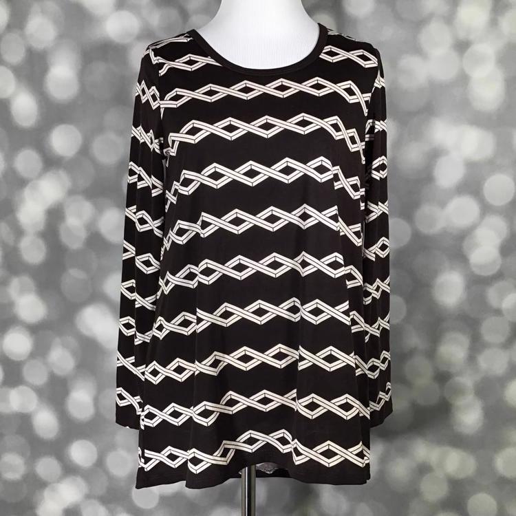 Front view of mannequin wearing LuLaRoe Lynnae Top in brown with ivory zig-zag stripe geometric print, long sleeves, and scoop neckline