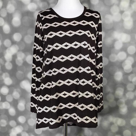 Front view of mannequin wearing LuLaRoe Lynnae Top in brown with ivory zig-zag stripe geometric print, long sleeves, and scoop neckline