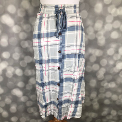 LuLaRoe Marsha Skirt with button-front detail featuring a blue, gray, and white plaid print with elastic waistband and drawstring tie on a mannequin against a blurred gray background