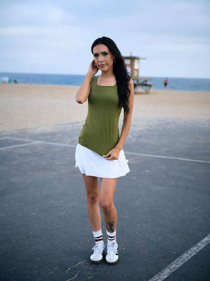 Model wearing the LuLaRoe Robyn Fitted Tank in solid olive green