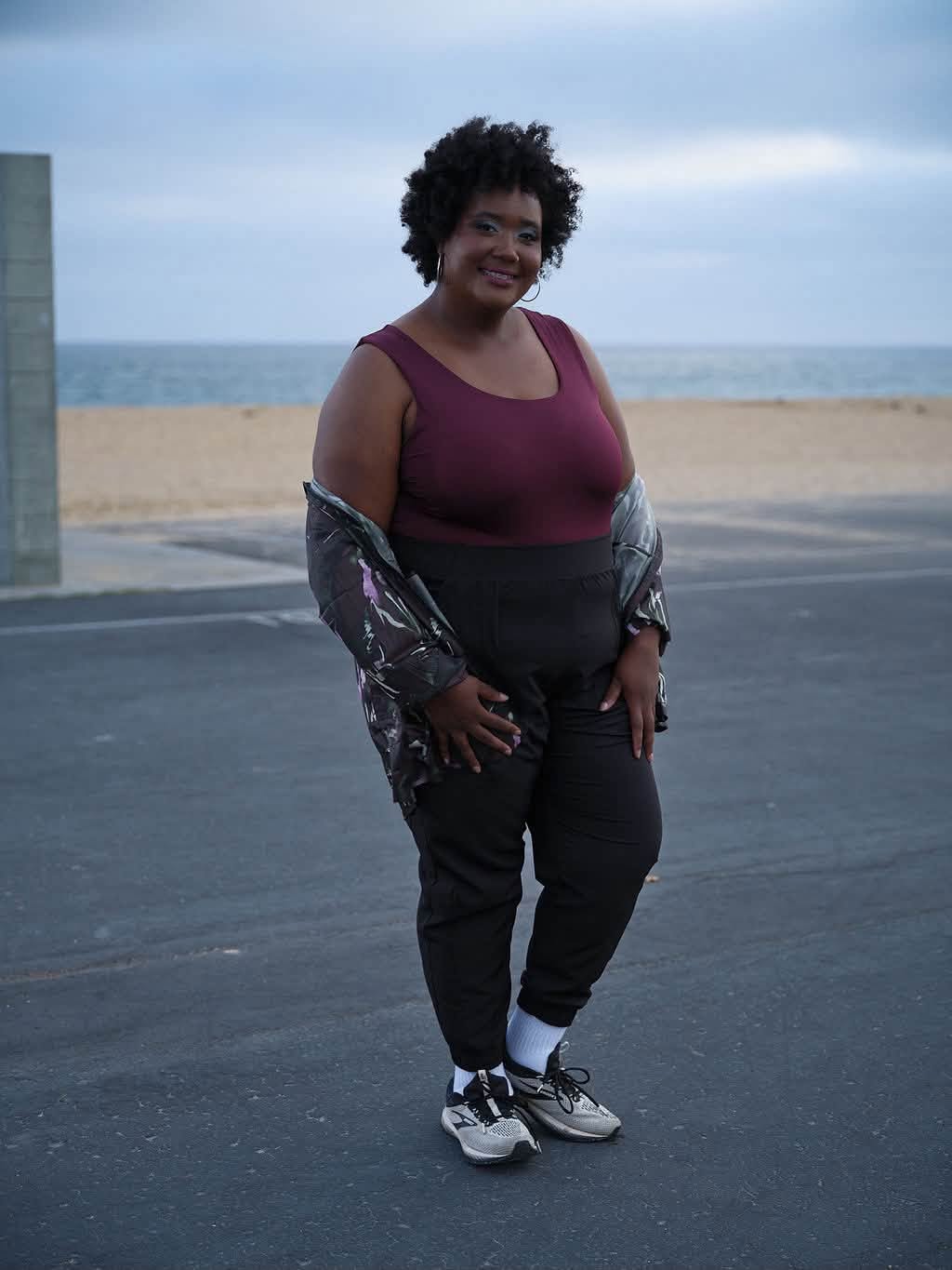 Model wearing the LuLaRoe Robyn Fitted Tank in solid deep plum