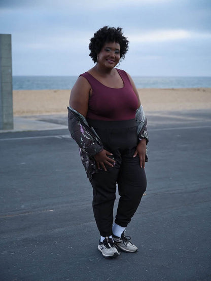 Model wearing the LuLaRoe Robyn Fitted Tank in solid deep plum