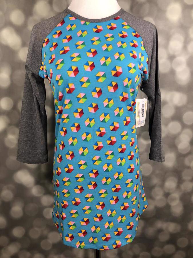 Front view of LuLaRoe Randy T on mannequin featuring vivid blue body with colorful cube pattern and gray raglan sleeves