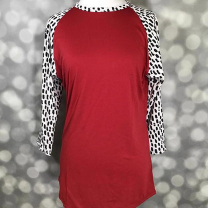 LuLaRoe Randy Tee in red with contrasting white and black spotted raglan sleeves and relaxed fit