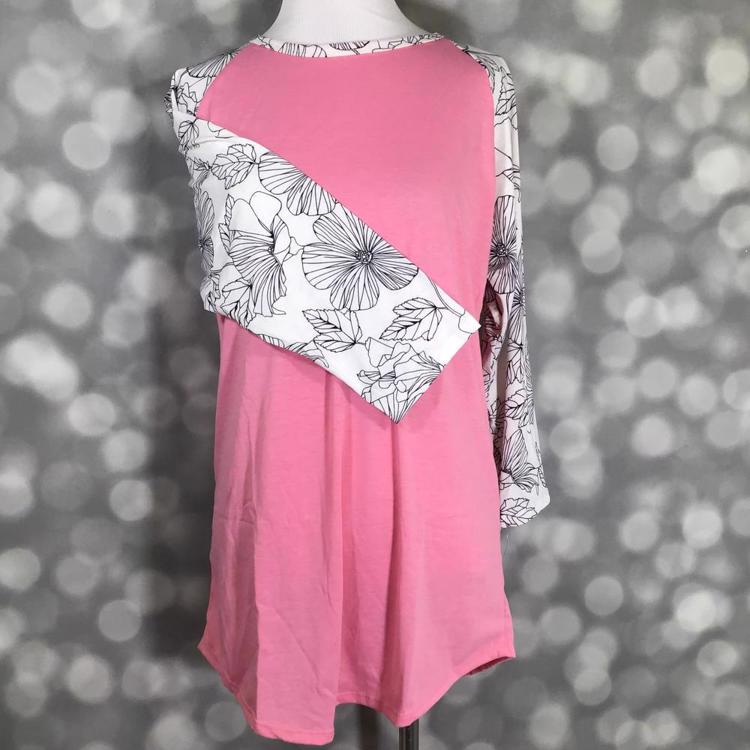 LuLaRoe Randy Tee with pink colorblock body and black and white floral line art print on a mannequin