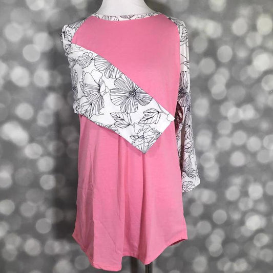 LuLaRoe Randy Tee with pink colorblock body and black and white floral line art print on a mannequin