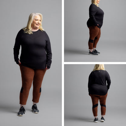 RISE Limitless Long Sleeve Top in solid black with a crew neckline and long sleeves shown from front, side, and back views on a model on a gray background.