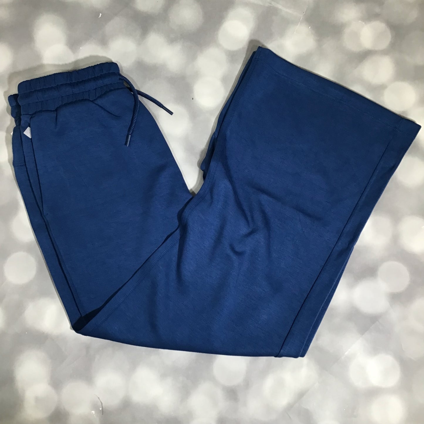 RISE Recharge pull-on sweatpant in solid classic blue with a high-rise elastic waistband and wide leg fit on a light gray background