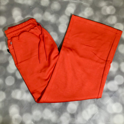 RISE Recharge pull-on sweatpant in solid poppy red with a high-rise elastic waistband and relaxed wide leg fit.