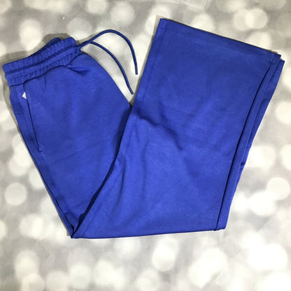 RISE Recharge pull-on sweatpant in solid royal cobalt blue with a high-rise elastic waistband and wide leg fit on a textured gray background