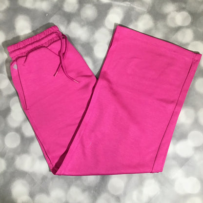 RISE Recharge pull-on sweatpant in solid vibrant fuchsia with a high-rise elastic waistband and wide leg fit on a gray background