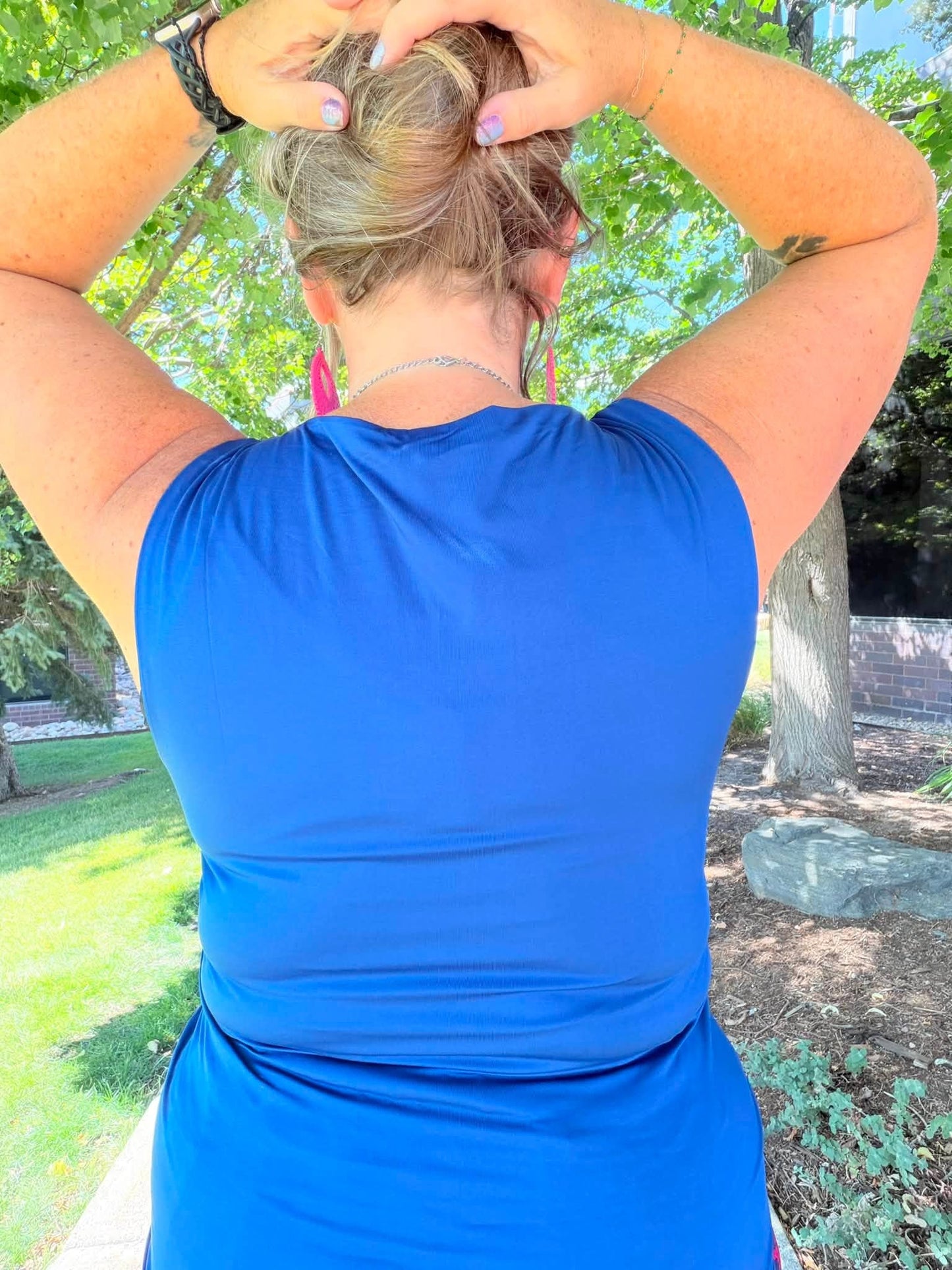 Model wearing the LuLaRoe Robyn Fitted Tank in solid royal blue