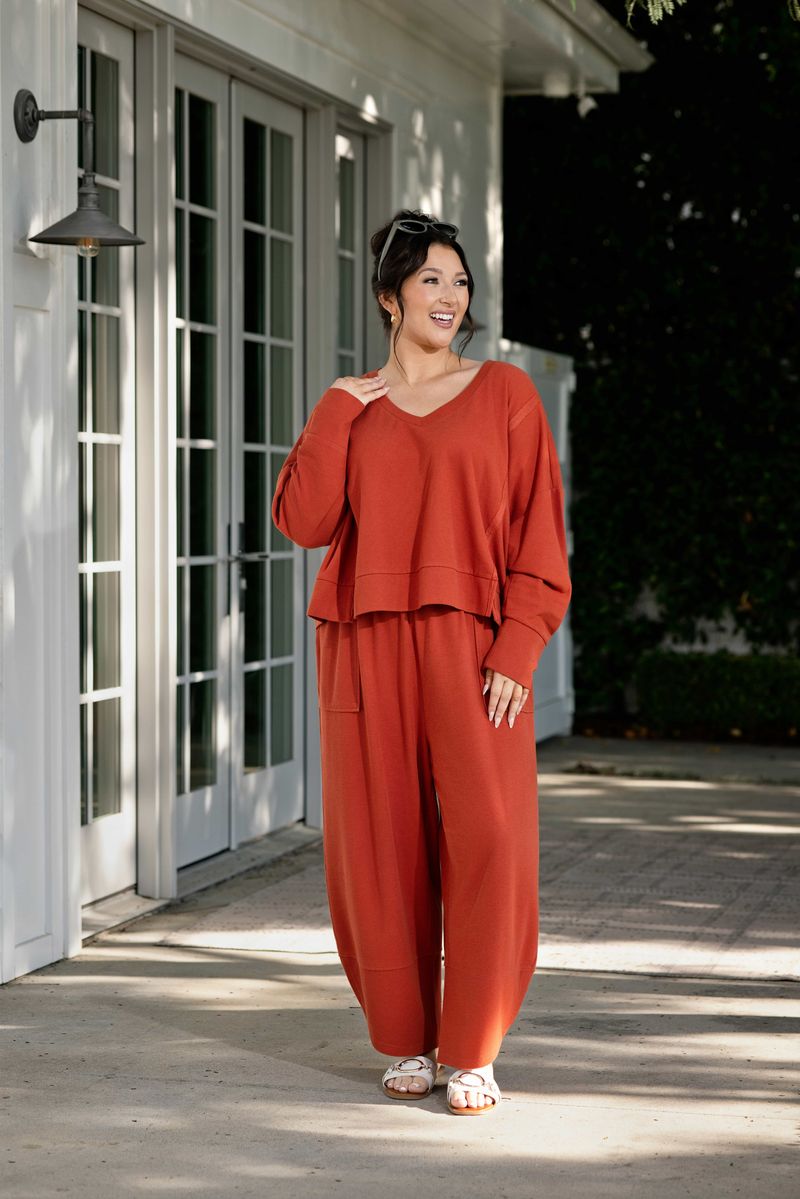 Lifestyle view 2 of the LuLaRoe Wendy Easy Barrel Pull-On Pant in Solid Rust Orange