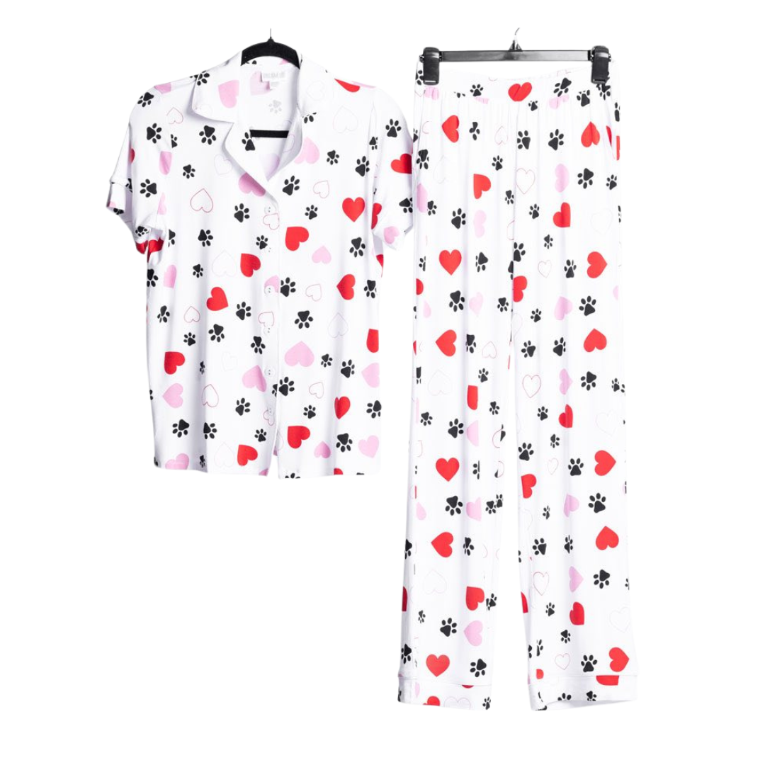 LuLaRoe Serene Set in white heart and paw print featuring red and blush hearts with black paw accents, styled as a relaxed button-front top and coordinating pull-on lounge pants on a white background