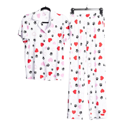 LuLaRoe Serene Set in white heart and paw print featuring red and blush hearts with black paw accents, styled as a relaxed button-front top and coordinating pull-on lounge pants on a white background