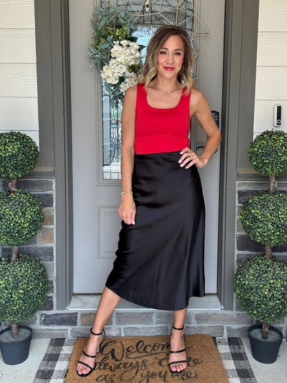 Model wearing the LuLaRoe Robyn Fitted Tank in solid crimson red