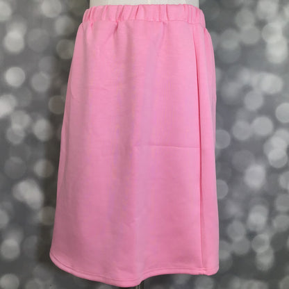 LuLaRoe Samantha Skirt in Solid Bubblegum Pink, a women's pull-on midi skirt featuring a non-roll elastic waistband and soft Modal Scuba fabric. Bright pink midi skirt with a flattering silhouette, perfect for spring outfits, casual wear, vacation styling, and everyday comfort on a mannequin against a blurred gray background