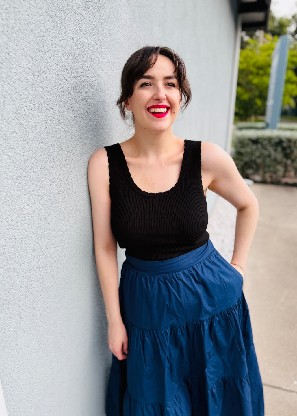 LuLaRoe Maydene Scallop Edge Tank in Solid Black with rib knit fabric, fitted silhouette, and scalloped neckline and arm openings. Alternate product image.