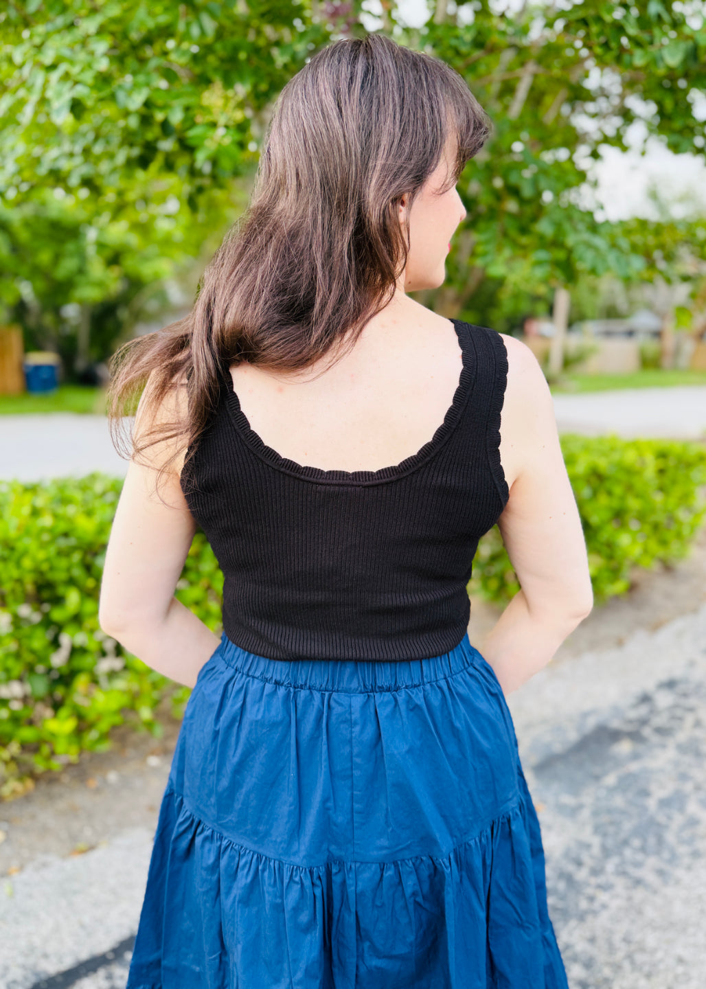 LuLaRoe Maydene Scallop Edge Tank in Solid Black with rib knit fabric, fitted silhouette, and scalloped neckline and arm openings. Alternate product image.