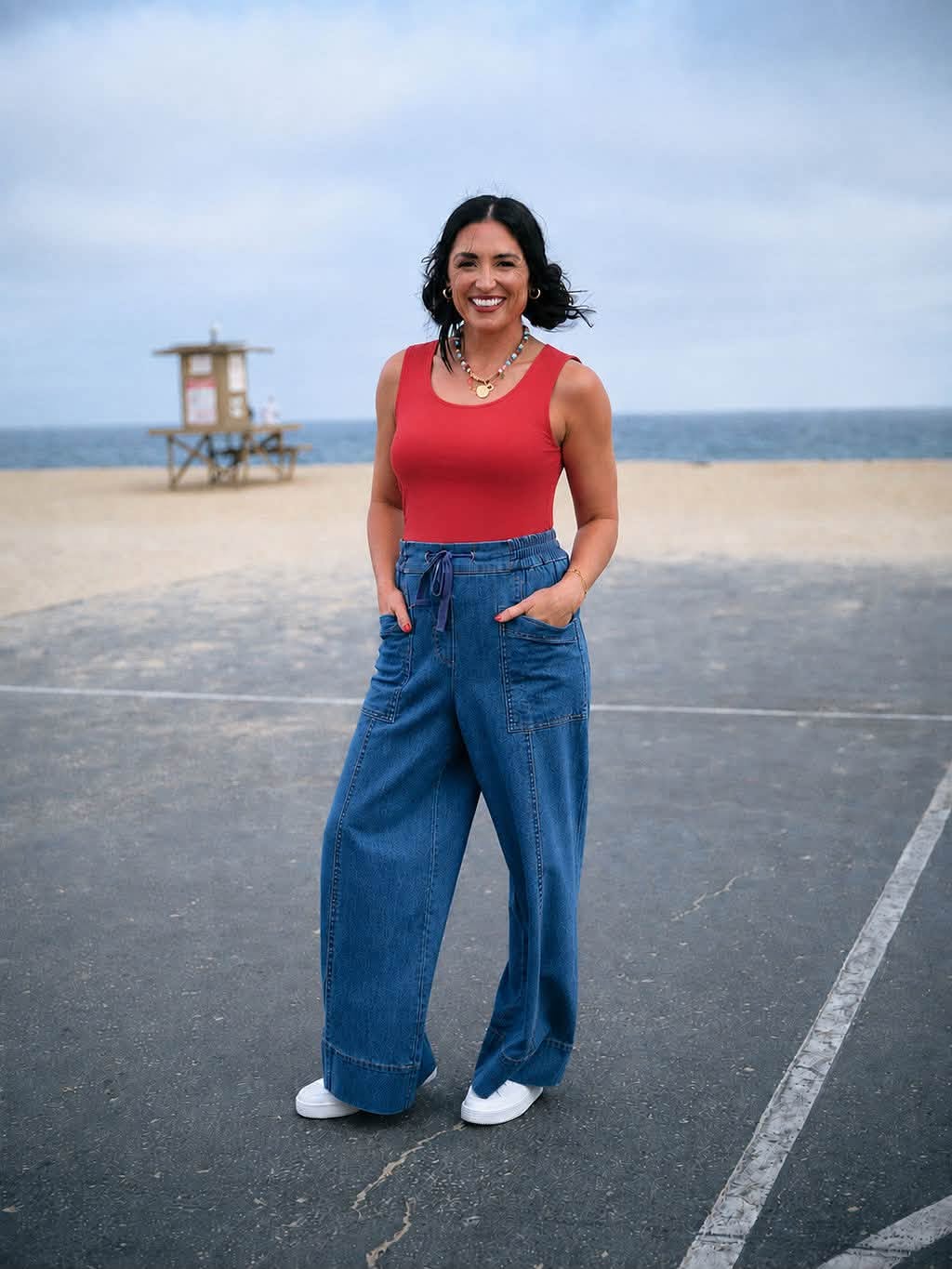 Model wearing the LuLaRoe Robyn Fitted Tank in solid crimson red